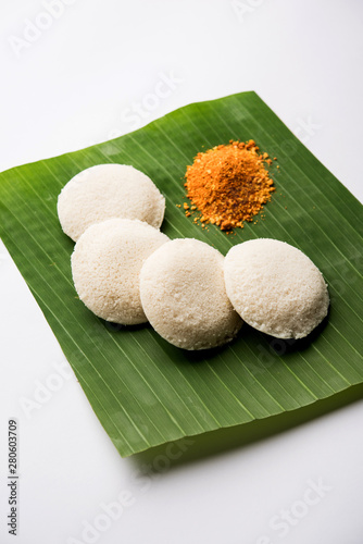 Podi idli is a quick and easy snack made with leftover idly. served with sambar and coconut chutney. selective focus photo