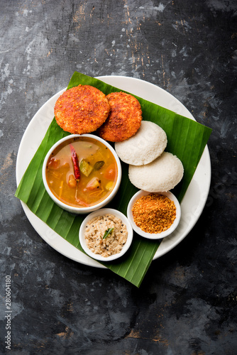 Podi idli is a quick and easy snack made with leftover idly. served with sambar and coconut chutney. selective focus photo