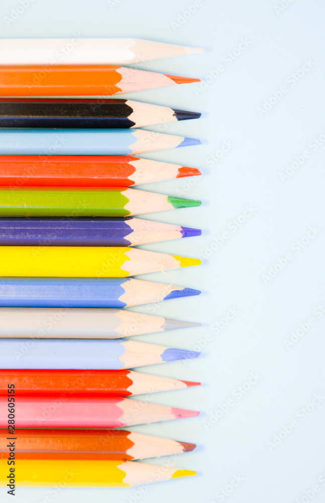 Colored pencils on a light blue background Colored pencils on a light blue background