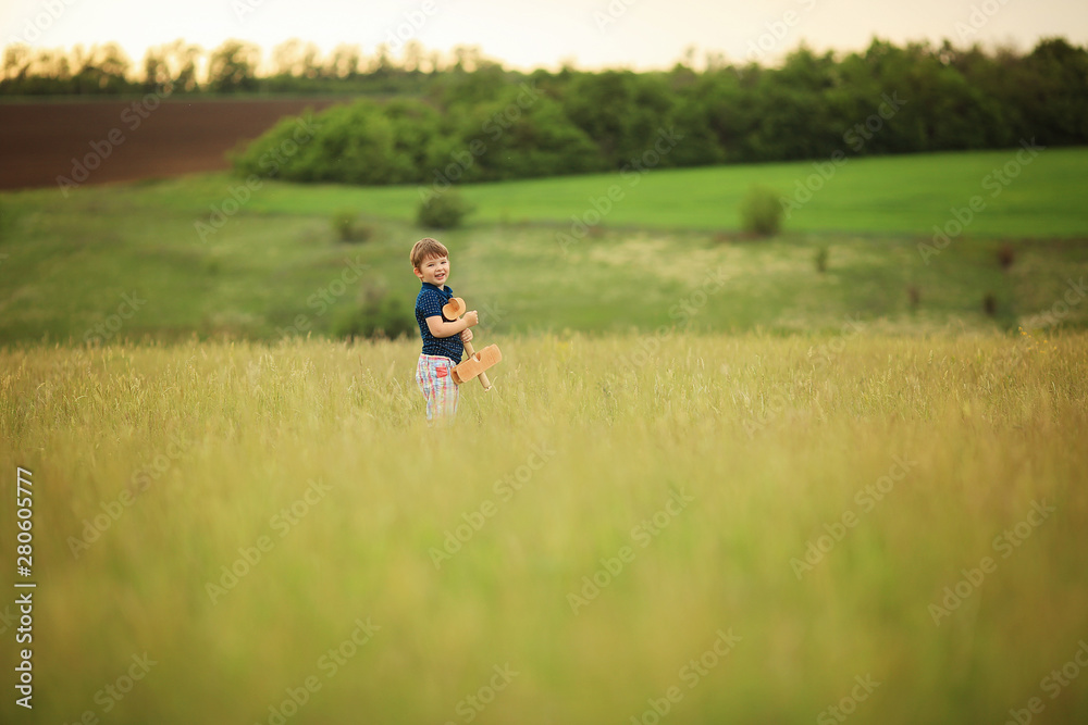 Boy with a wooden plane