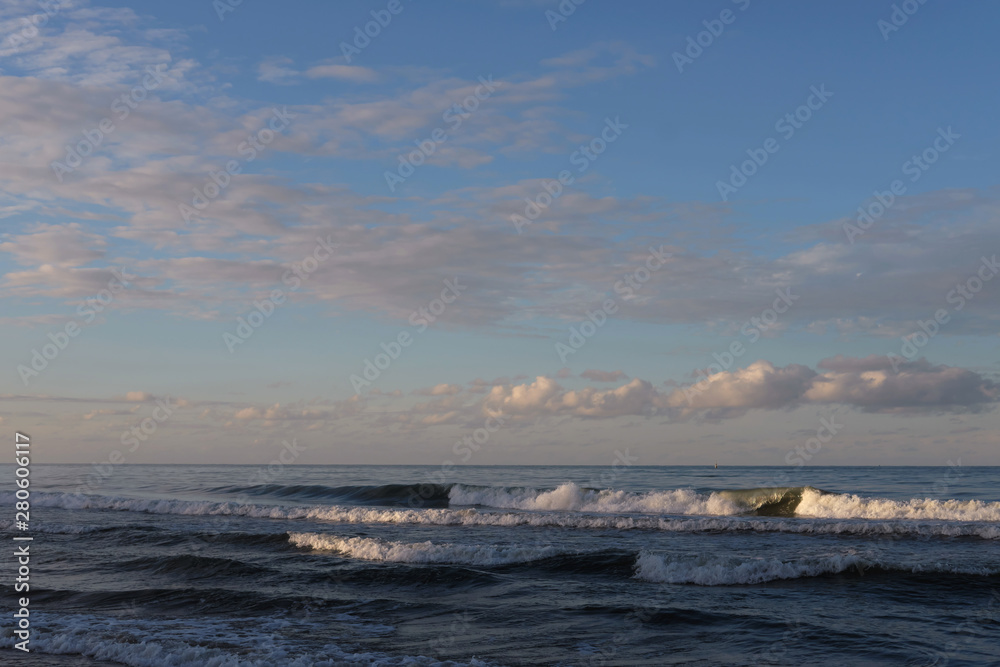 beautiful sunset beach with dramatic clouds and sky background