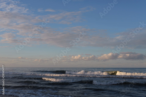 beautiful sunset beach with dramatic clouds and sky background