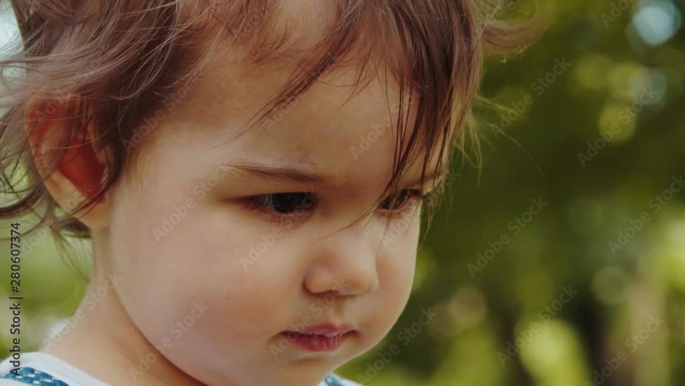 Cute baby girl exploring a park in summer. Real life, candid 4K footage. Cute baby girl exploring a park in summer. Real life, candid 4K footage.