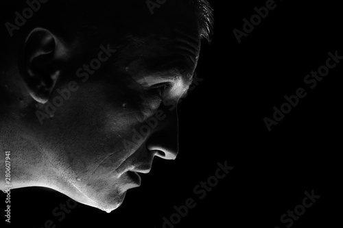 black and white photo half-face man with water drops or sweat