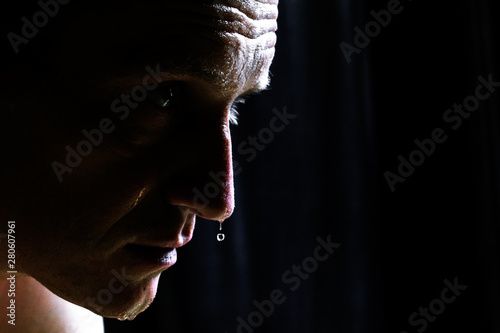half-face man with water drops or sweat