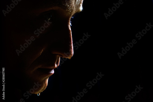 half-face man with water drops or sweat