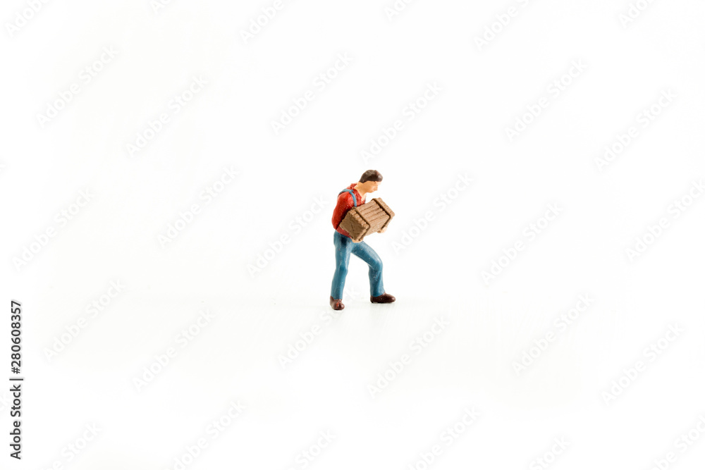 Iconic photo of a Man holding a Box/Chest, Miniature person with white isolated background Iconic photo of a Man holding a Box/Chest, Miniature person with white isolated background