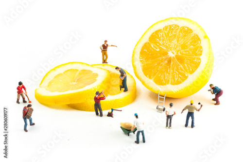 People Working with Food, Miniature people harvesting a Lemon, construction site