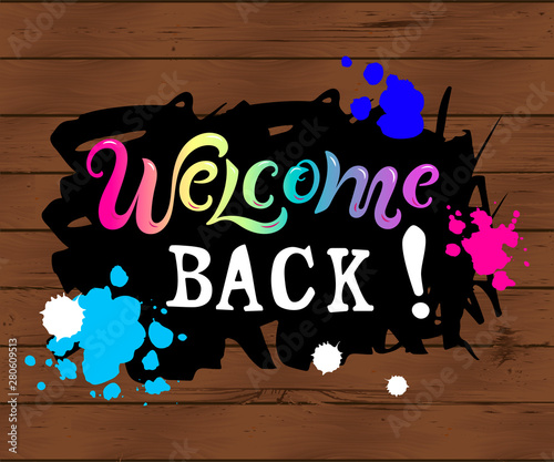 Welcome back! text isolated on wooden texute background. Handwriting lettering Welcome. Vector illustration for flyer, school fair, sale, announcement. photo