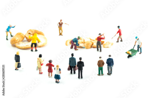 People Working with Food, Miniature people harvesting nuts/cashews, construction site