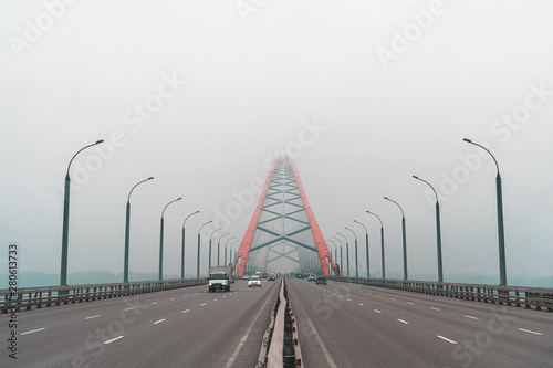 Novosibirsk car Bugrinskij bridge in the fog photo