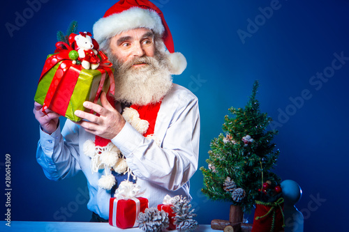 Elderly man prepares gifts ...