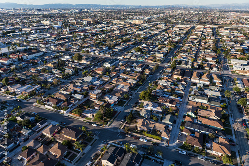 Afternoon aerial view of middle class homes and streets in Los Angeles County, California. 
