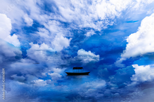 Beautiful Lake and single Boat with surround clouds.