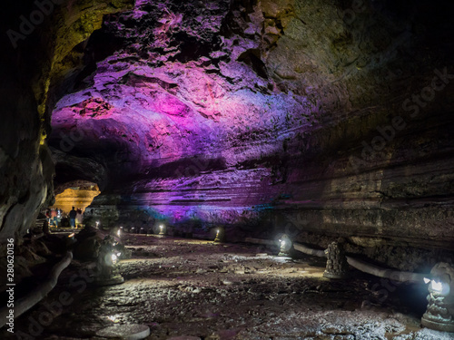 The corridor inside the Manjanggul cave with lights to watch the flow of lava flows.  At Jeju Island, South Korea.