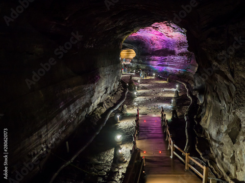 The corridor inside the Manjanggul cave with lights to watch the flow of lava flows.  At Jeju Island, South Korea.