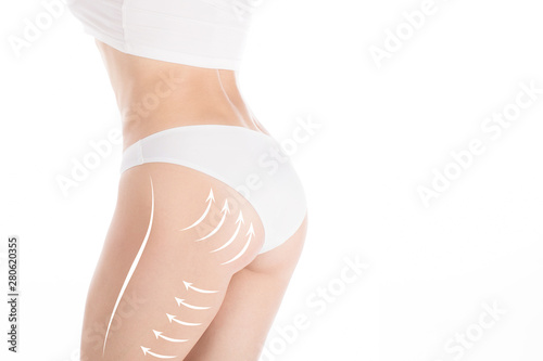 Woman attractive fit body and butt in base underwear. Lifting marking with arrows in female buttocks and hips, isolated on white photo