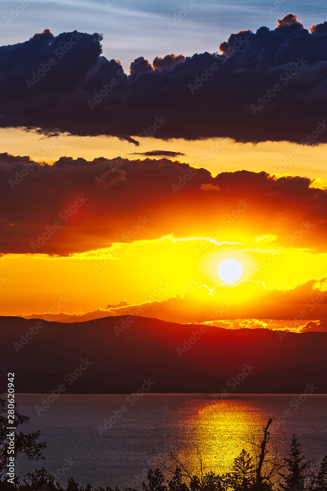 Fototapeta premium Sunset Over Lake in Summer