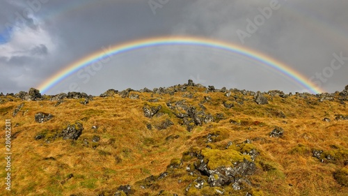 Rainbow, lava field, grass and lichens, Iceland, Europe