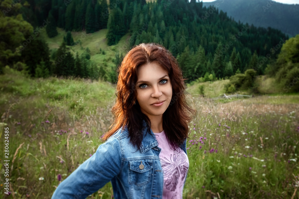 Portrait of a beautiful girl on the background of the beautiful Carpathian mountains. Travel concept, leisure activity, vacation Portrait of a beautiful girl on the background of the beautiful Carpathian mountains. Travel concept, leisure activity, vacation