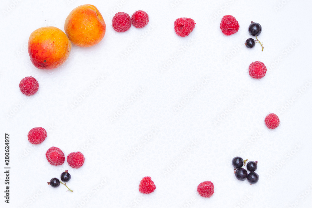 Summer background concept. Frame from raspberries, currants, apricots on white background. Summer background concept. Frame from raspberries, currants, apricots on white background.
