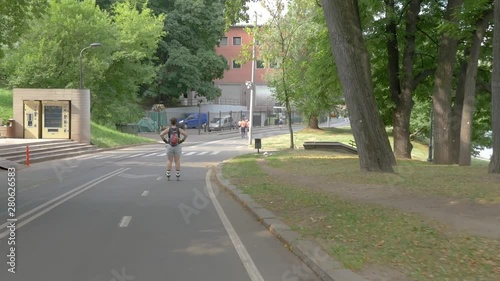 Wallpaper Mural middle-aged woman rollerblading along a river in a park Torontodigital.ca