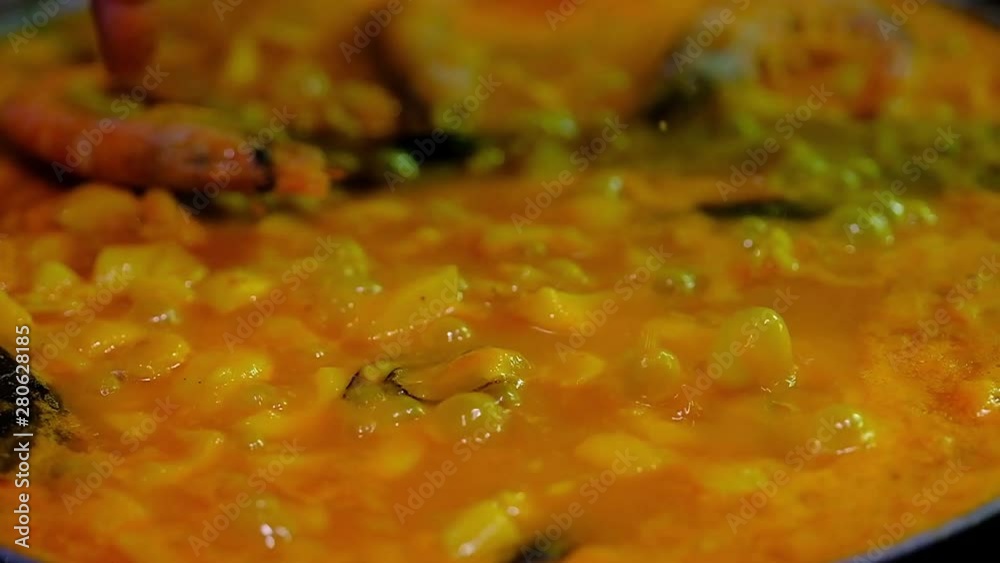 preparation and elaboration with all the ingredients for a very delicious Spanish paella, concept cuisine preparation and elaboration with all the ingredients for a very delicious Spanish paella, concept cuisine