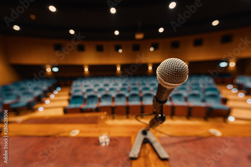 Close up view of microphone in concert hall photo