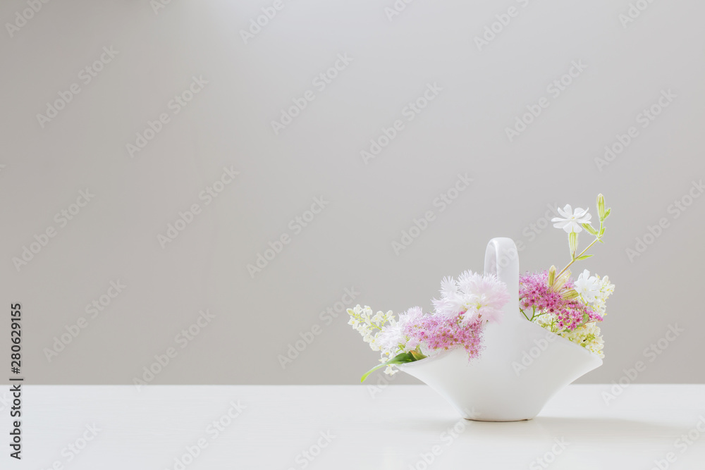 bouquet of flowers in vase on a white background