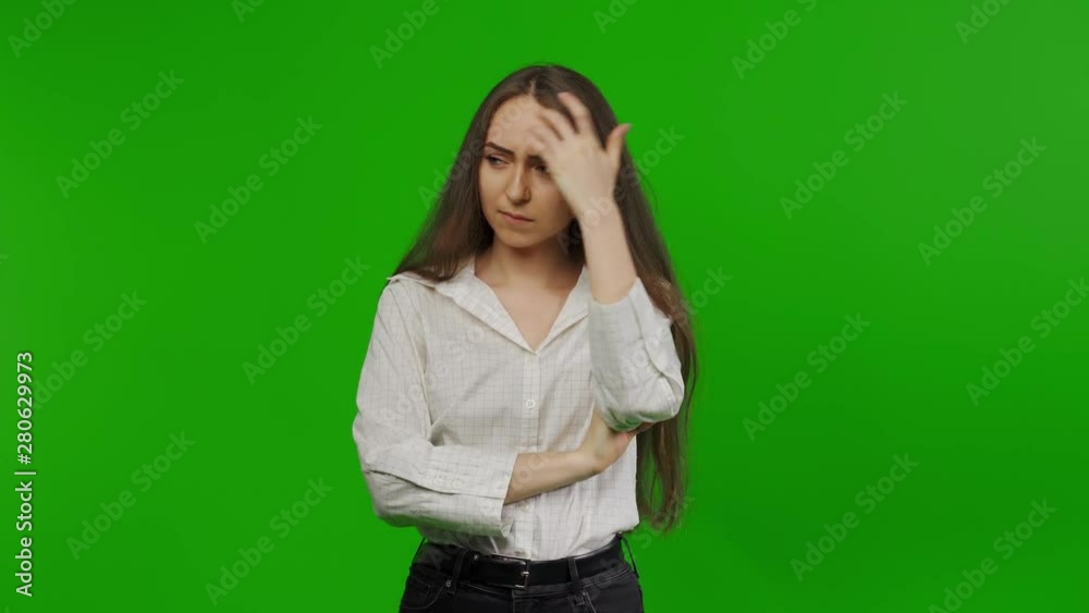 an insulted woman looks at the sides. She does not want to talk. Angry woman is going to punish everyone. Green Screen, Chroma Key. an insulted woman looks at the sides. She does not want to talk. Angry woman is going to punish everyone. Green Screen, Chroma Key.