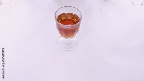glass of water with ice on black background