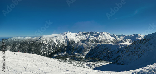 Snow covered Pirin mountains winter panorama.