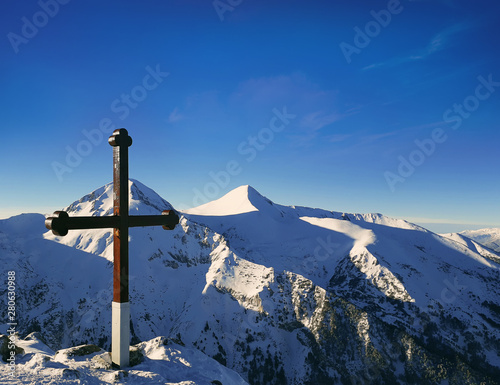Cross on the top of Pirin mountains. Todorka peak national resort in Bansko, Bulgaria.