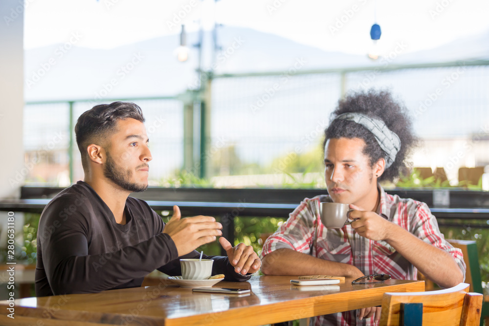 Friends have fun sharing a coffee Friends have fun sharing a coffee