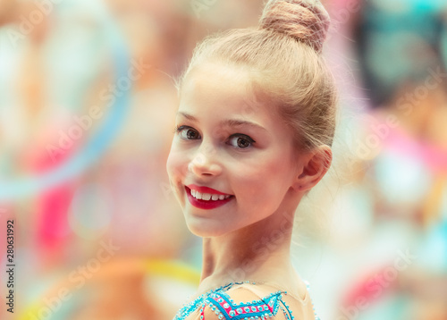 Portrait of a happy gymnast girl