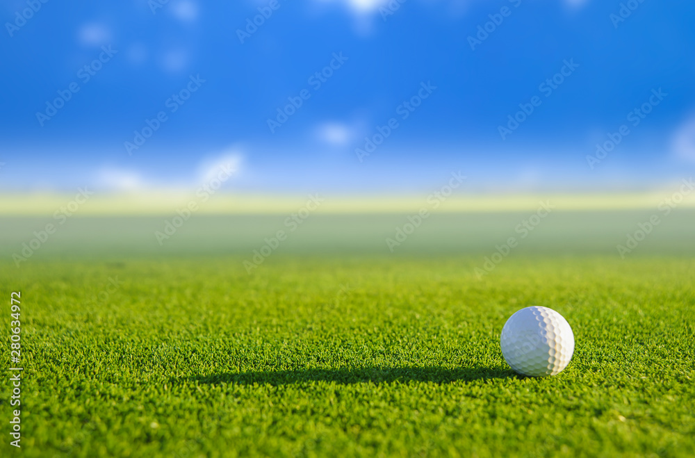 Golf ball on green grass with blur background Golf ball on green grass with blur background