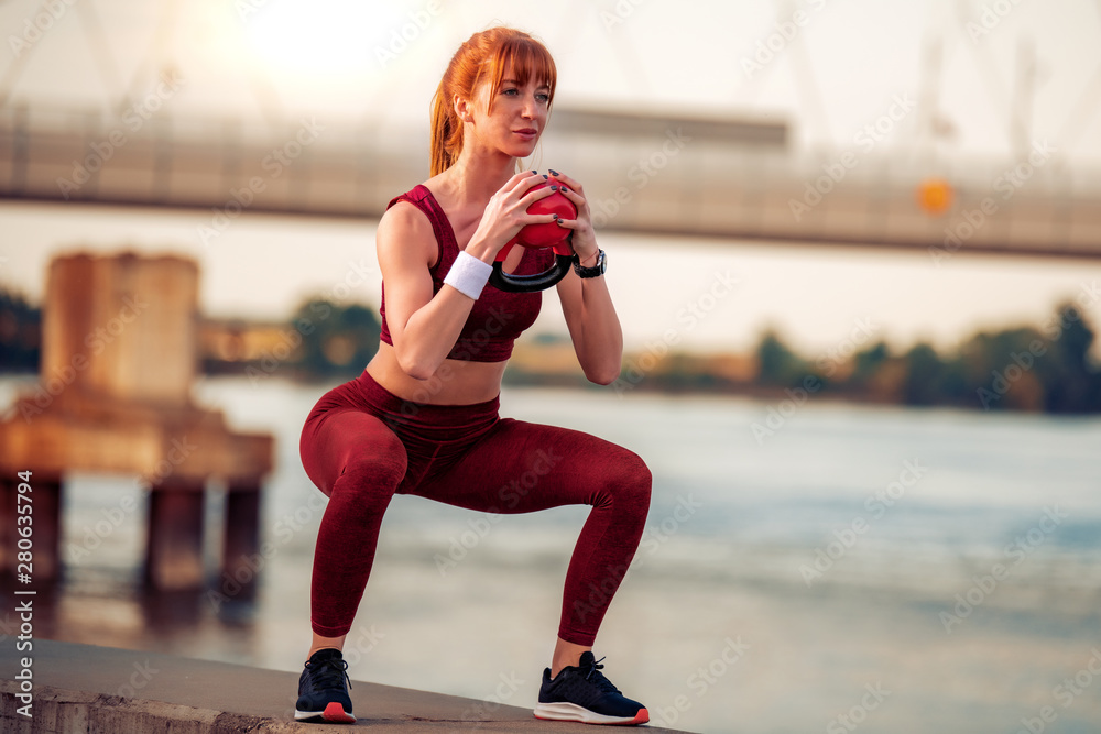 Fototapeta premium Woman doing squats