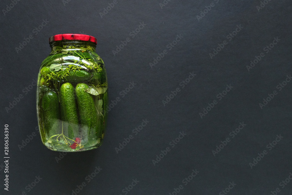 Φωτογραφία Can of pickles for the winter on a black background