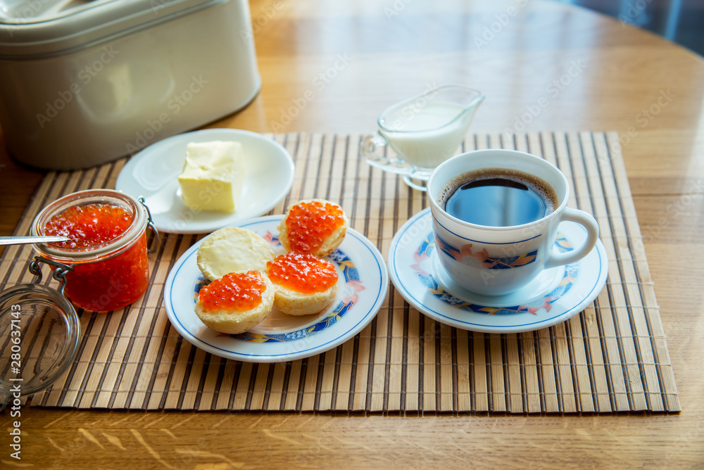 Breakfast,  Cup of coffee and a sandwich with red caviar