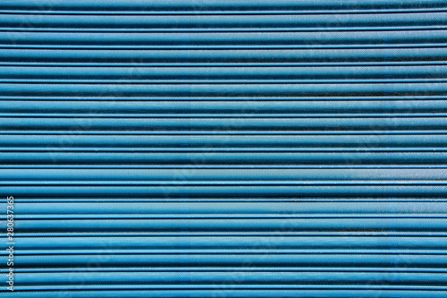 Blue corrugated metal shutter background texture