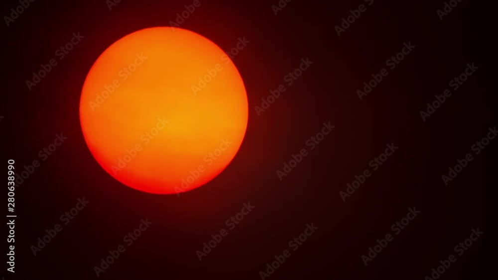 Red sun sphere in thick smog Red sun sphere in thick smog