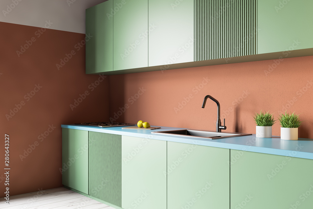 kort Grønthandler filthy Orange kitchen with green countertops Stock-foto | Adobe Stock