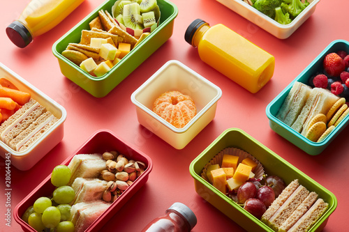 Plastic lunch boxes with food. photo