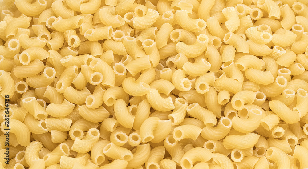 Horns pasta in in quantities - macaroni texture Horns pasta in in quantities - macaroni texture