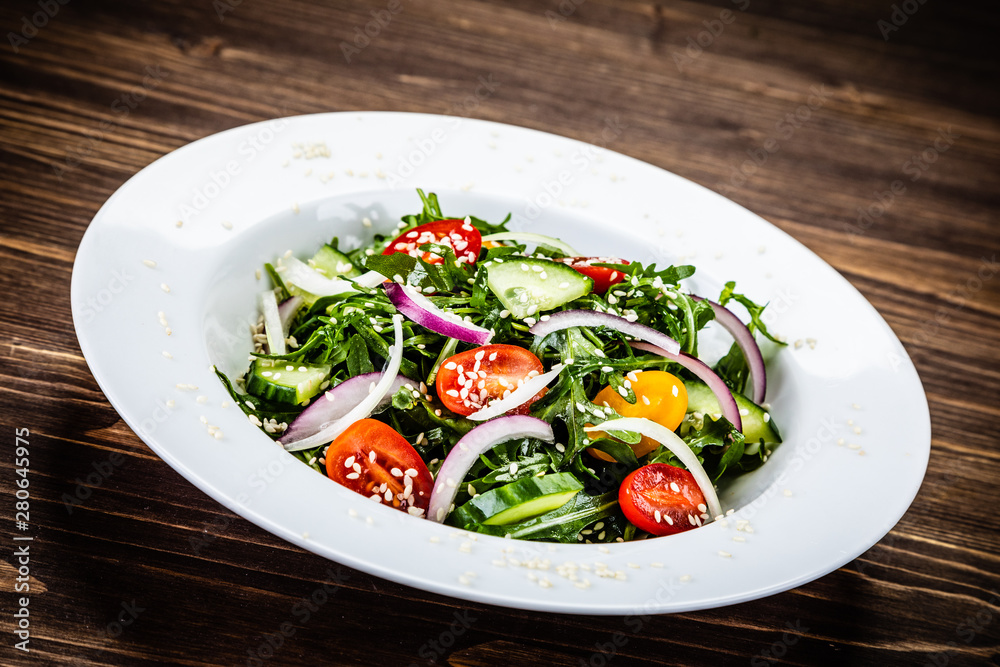 Greek salad on wooden background