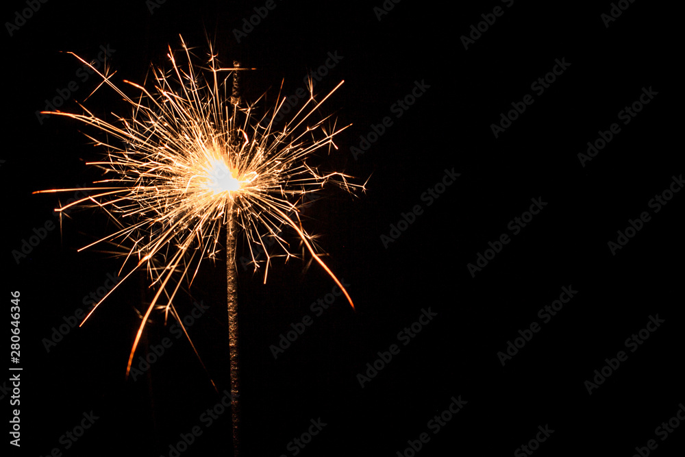 magic sparkler light on black background, christmas firework