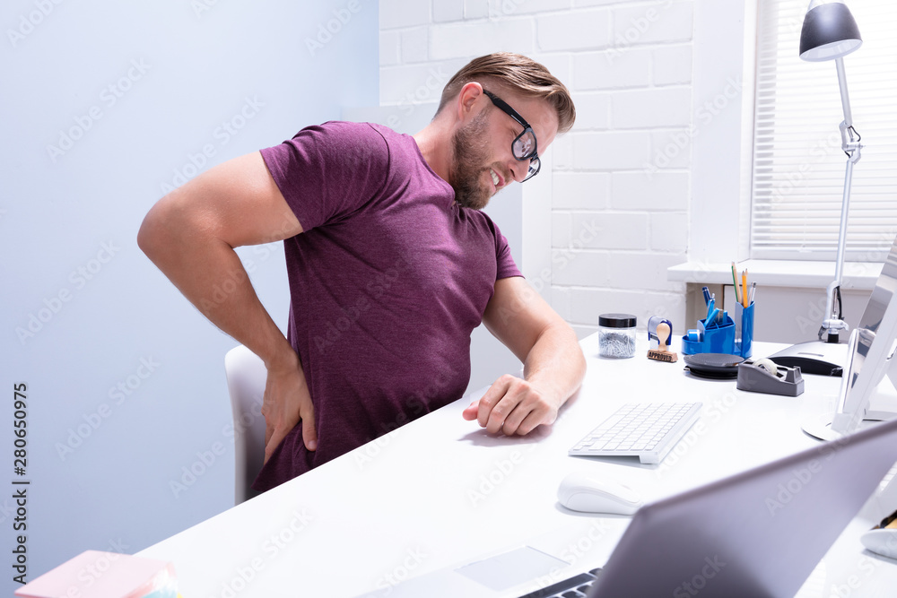 Young Businessman Having Back Pain