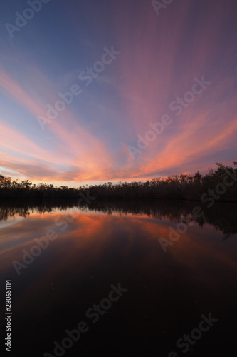 Colorful sunset on Coot Bay Pond in Everglades National Park  Florida on a calm winter evening.