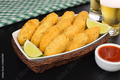 Traditional recipe codfish balls in black background photo