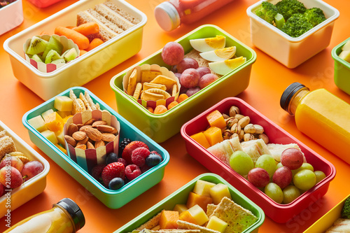 Lunchboxes and bottles of smoothie. photo